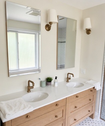 Double vanity with light wood cabinets