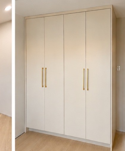 White wardrobe with brass handles