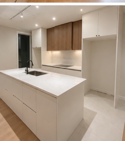 Kitchen island with wood upper cabinets