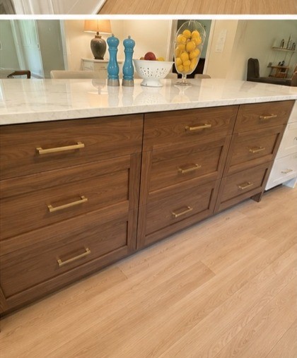 Walnut kitchen island with waterfall countertop